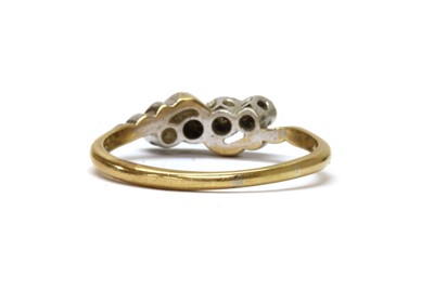 Lot 1174 - A gold four stone diamond ring