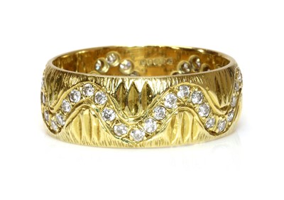 Lot 244 - An 18ct gold diamond set band ring, c.1970