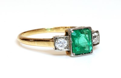 Lot 348 - A three stone emerald and diamond ring