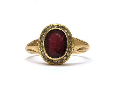 Lot 1232 - A gold garnet and diamond cluster ring