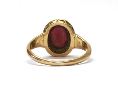 Lot 1232 - A gold garnet and diamond cluster ring