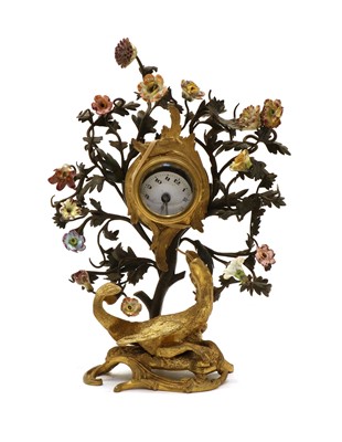 Lot 213 - A German gilt metal and floral porcelain mounted drum head clock