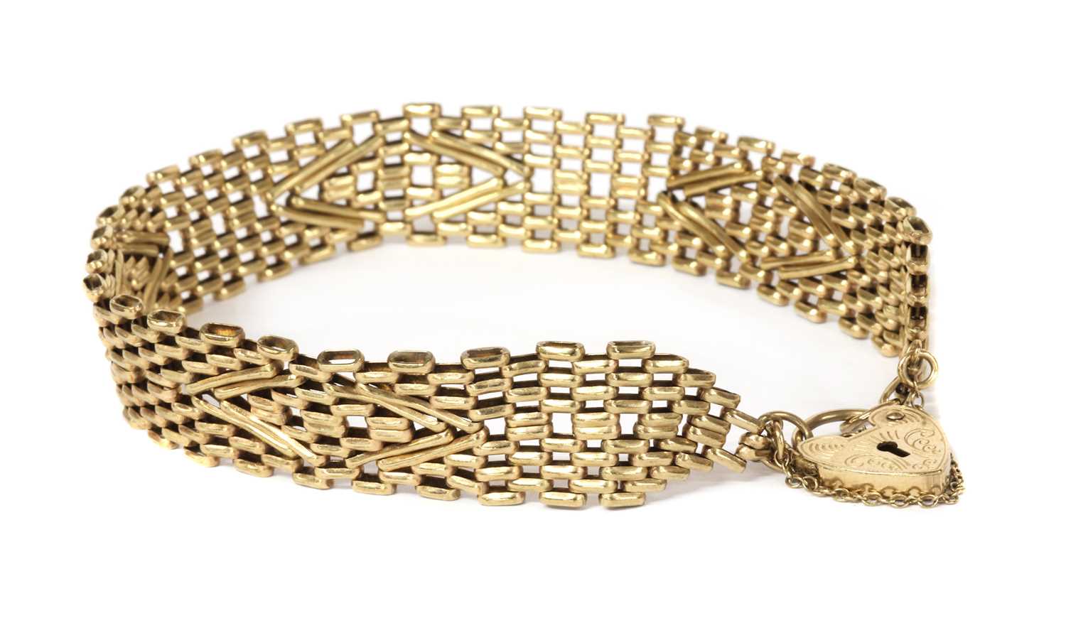 Lot 1114 - A 9ct gold gate bracelet