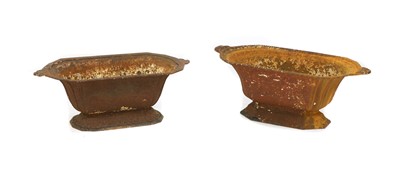 Lot 215 - A near pair of cast iron planters
