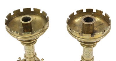 Lot 52 - A pair of Gothic Revival brass candlesticks