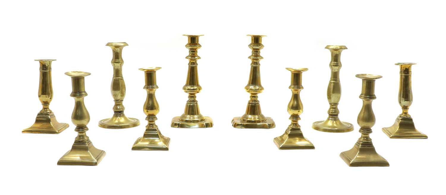 Lot 92 - Five pairs of 19th century brass candlesticks