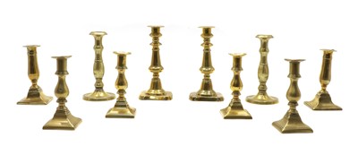 Lot 92 - Five pairs of 19th century brass candlesticks