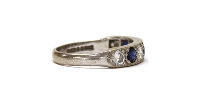 Lot 1284 - An 18ct white gold sapphire and diamond half eternity ring
