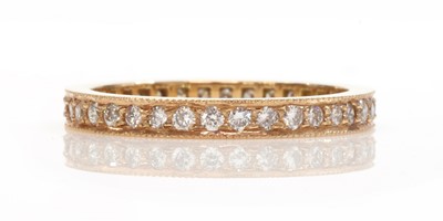 Lot 367 - A rose gold diamond set full eternity ring