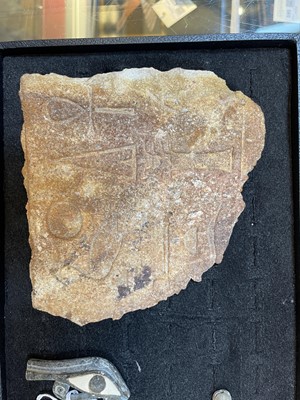 Lot 179 - An Egyptian inscribed quartzite fragment