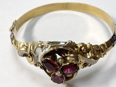 Lot 1 - A Swedish gold paste, split pearl and enamel hollow hinged bangle, c.1850