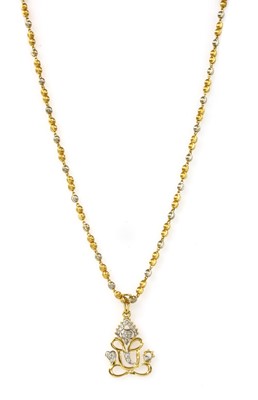 Lot 1152 - An Indian high carat gold pendant and chain