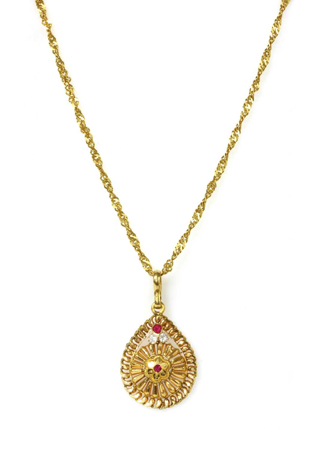 Lot 1155 - An Indian high carat gold paste pendant