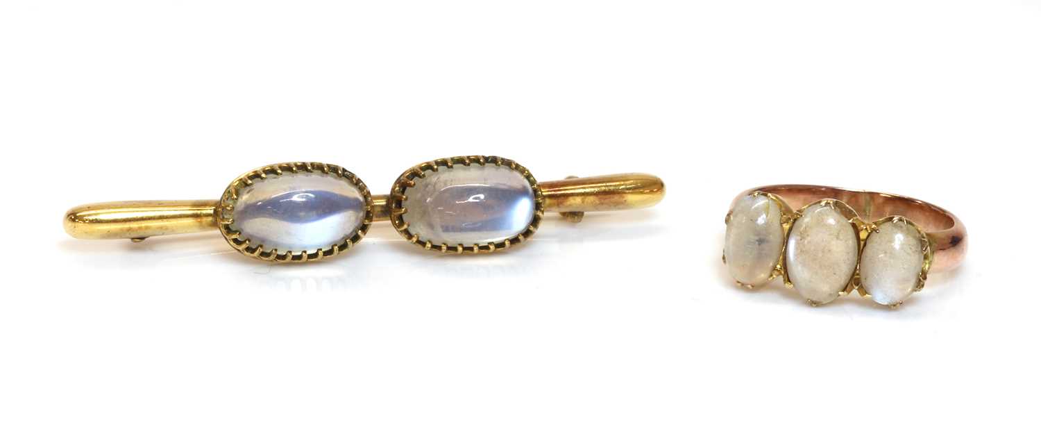 Lot 114 - A two stone moonstone bar brooch