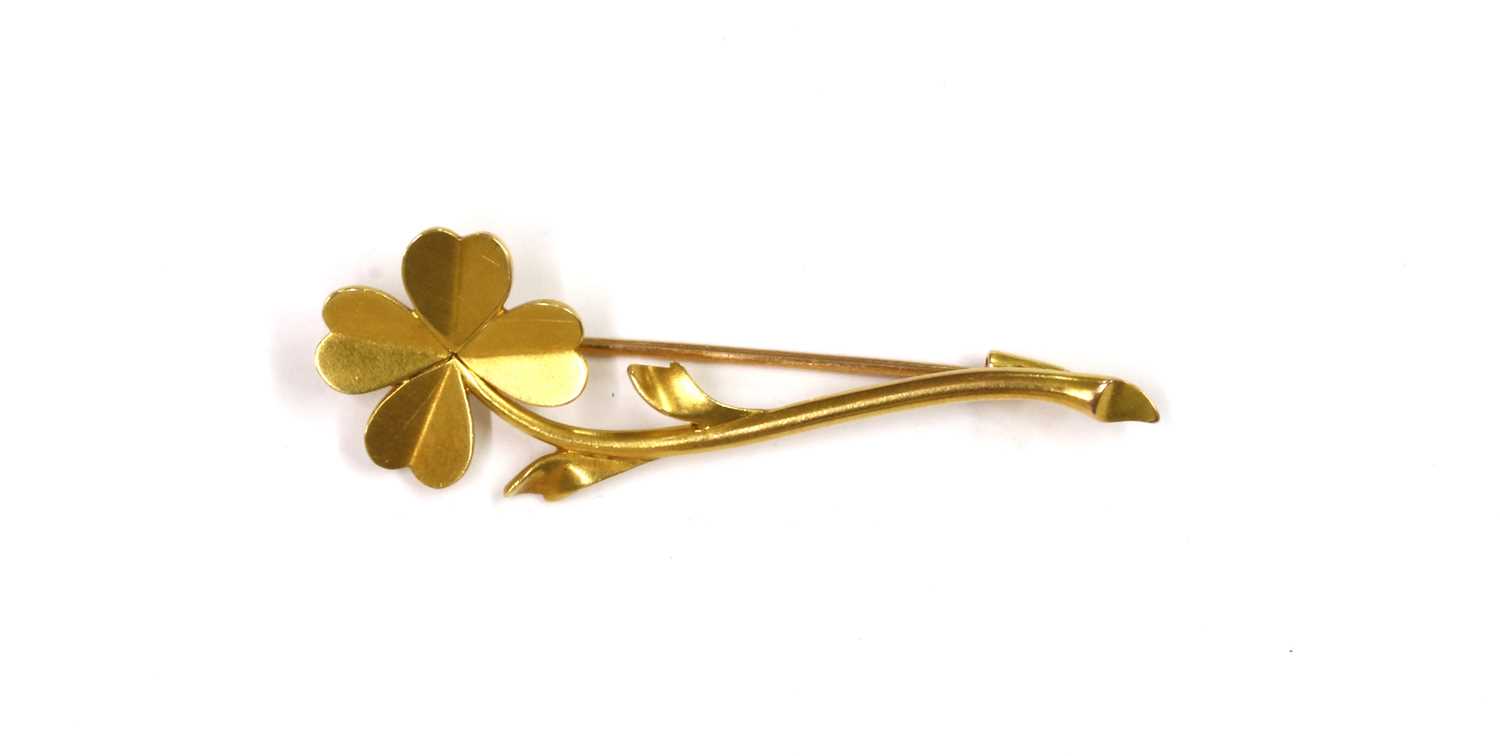 Lot 1055 - A French gold flower brooch