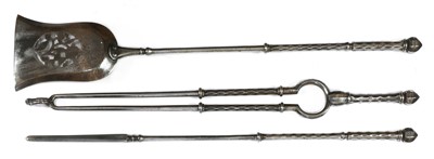 Lot 544 - A set of three George III steel fire tools