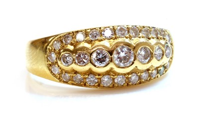 Lot 312 - A diamond set tapered band ring