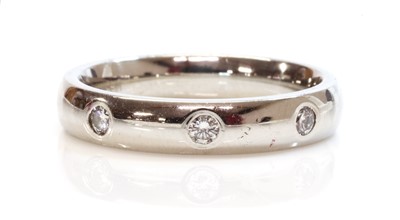 Lot 423 - A diamond set wedding ring or gyspy band ring
