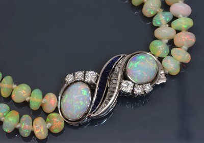 Lot 284 - A two row graduated opal bead necklace