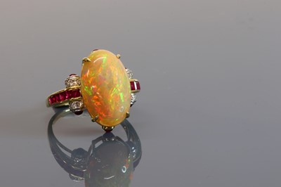 Lot 285 - An opal, ruby and diamond cluster ring