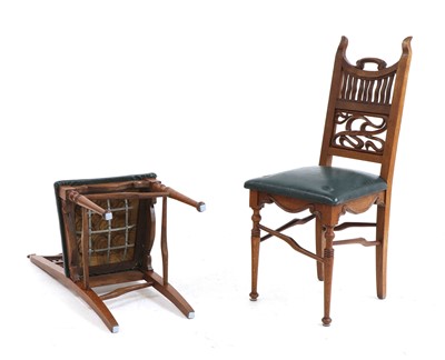 Lot 339 - A set of eight Arts and Crafts oak dining chairs