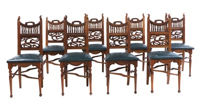 Lot 339 - A set of eight Arts and Crafts oak dining chairs