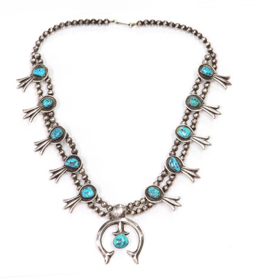 Lot 275 - A silver Navajo turquoise squash blossom necklace