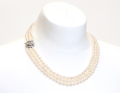 Lot 221 - A three row cultured pearl necklace and bracelet suite
