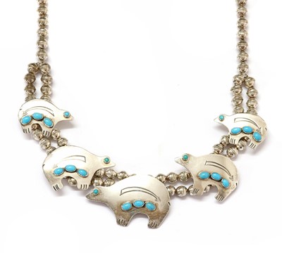 Lot 1339 - An American Southwest Indian silver and turquoise necklace, by Julius Hoskie