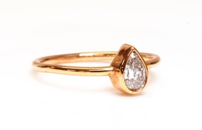 Lot 366 - A rose gold single stone pear cut diamond ring