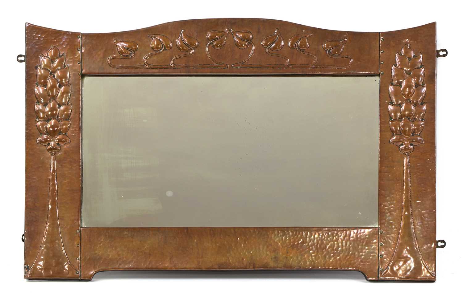 Lot 92 - A Scottish Arts and Crafts embossed copper wall mirror