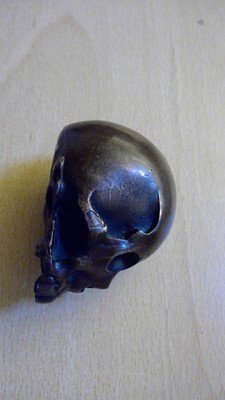 Lot 213 - A Japanese lacquered metal skull
