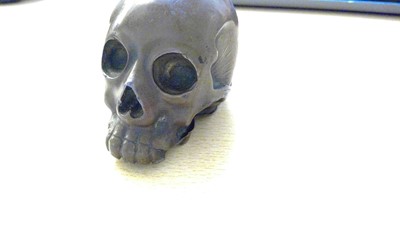 Lot 213 - A Japanese lacquered metal skull
