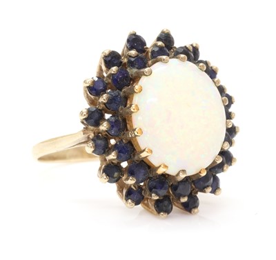 Lot 1297 - A 9ct gold opal and sapphire cluster ring