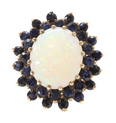 Lot 1297 - A 9ct gold opal and sapphire cluster ring