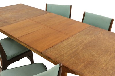 Lot 538 - A teak extending dining table
