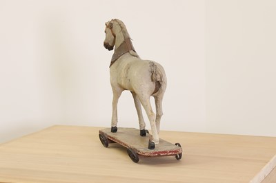 Lot 177 - A folk art pull-along horse