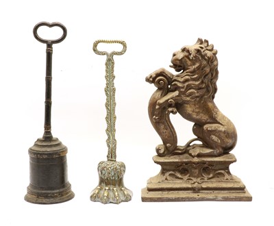 Lot 266 - A regency brass door porter in the form of a lions paw