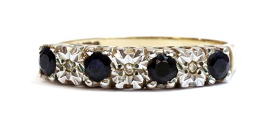 Lot 1290 - A 9ct gold sapphire and diamond half eternity ring
