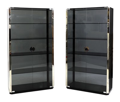 Lot 725 - A pair of smoked glass and chrome display cabinets