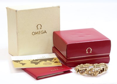 Lot 242 - A ladies' 18ct gold diamond set Omega mechanical cocktail bracelet watch, c.1970