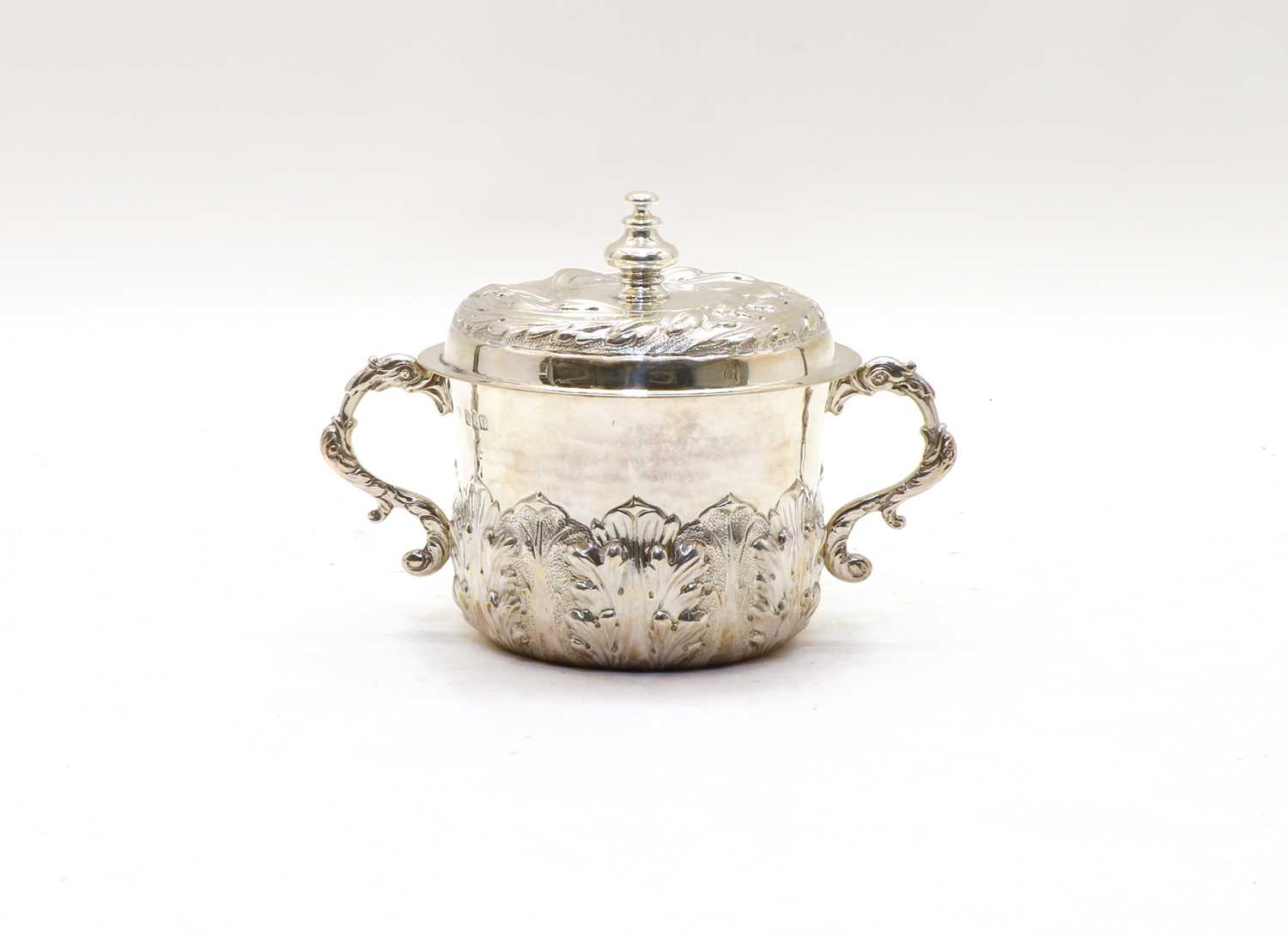 Lot 50 - A Charles II style Britannia silver porringer and cover