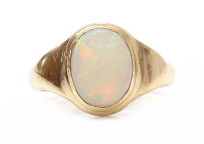 Lot 1301 - A gold single stone opal ring