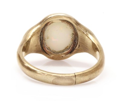 Lot 1301 - A gold single stone opal ring