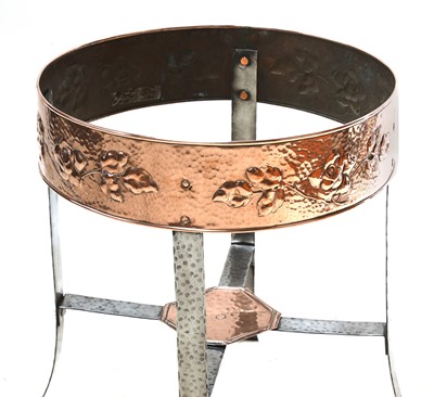 Lot 130 - An Arts and Crafts copper-embossed tray-top table