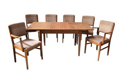 Lot 597 - A Gordon Russell teak and walnut extending dining table