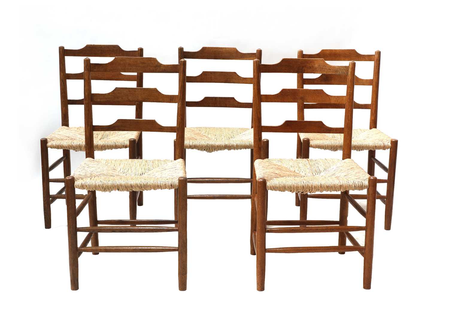 Lot 150 - Five Cotswold School 'Clissett'-style oak ladderback chairs