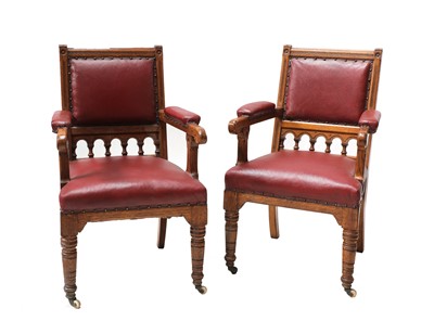 Lot 135 - A pair of oak library armchairs