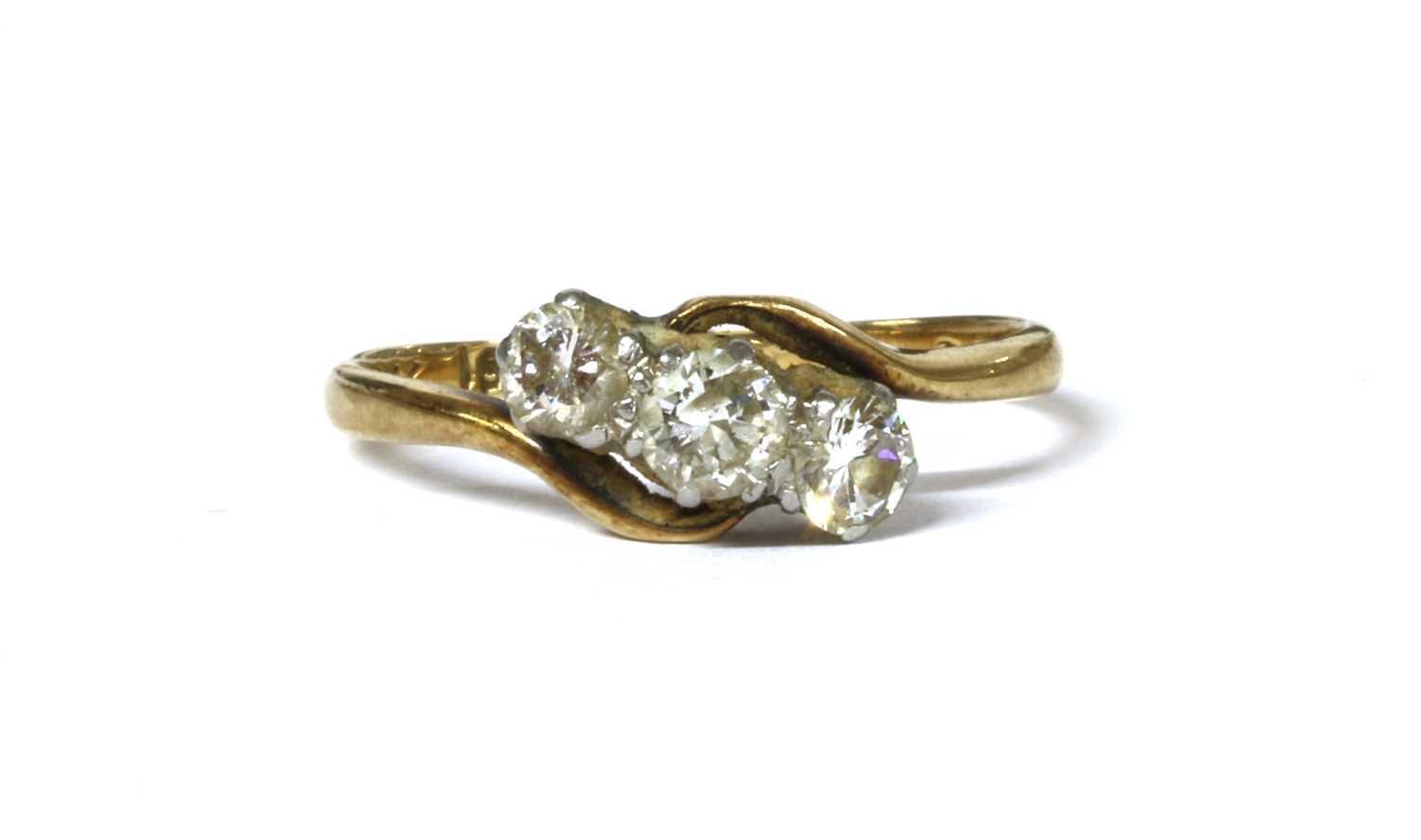 Lot 25 - A gold three stone diamond ring