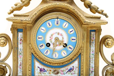 Lot 153 - A French Louis XVI-style gilt-bronze mantel clock